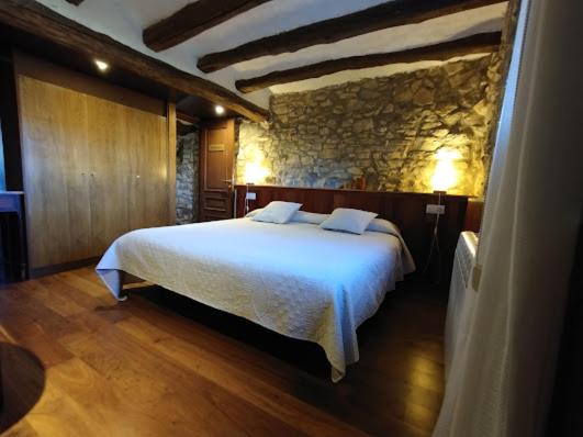Postel nebo postele na pokoji v ubytování Masia Serret
