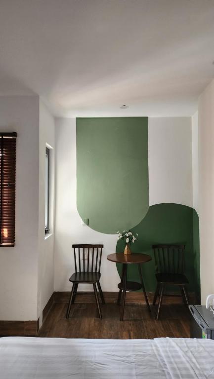 Postel nebo postele na pokoji v ubytování Lacovy Home Hội An