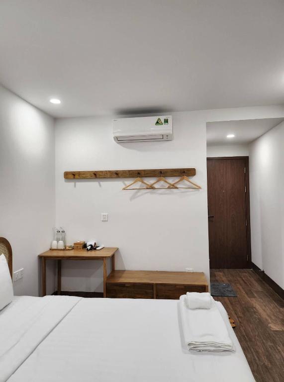 Postel nebo postele na pokoji v ubytování Lacovy Home Hội An