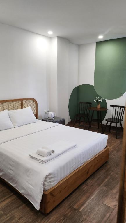 Postel nebo postele na pokoji v ubytování Lacovy Home Hội An