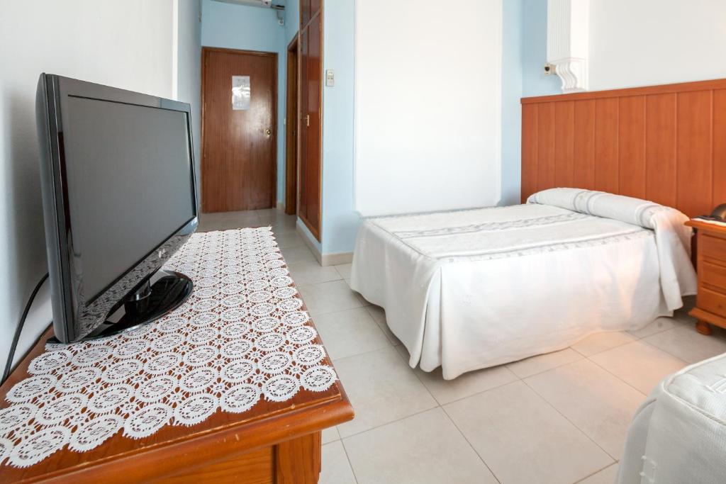 Televízia a/alebo spoločenská miestnosť v ubytovaní Hotel Restaurante Los Molinos