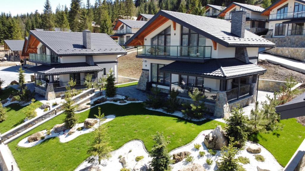 an aerial view of a house with a yard at EcoBerghaus - Котеджне містечко in Bukovel