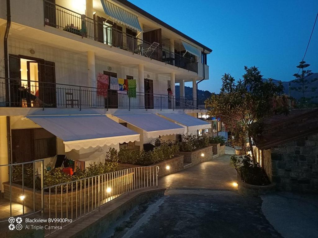 a building with an outdoor patio with lights on it at Il Moro della Molpa in Palinuro