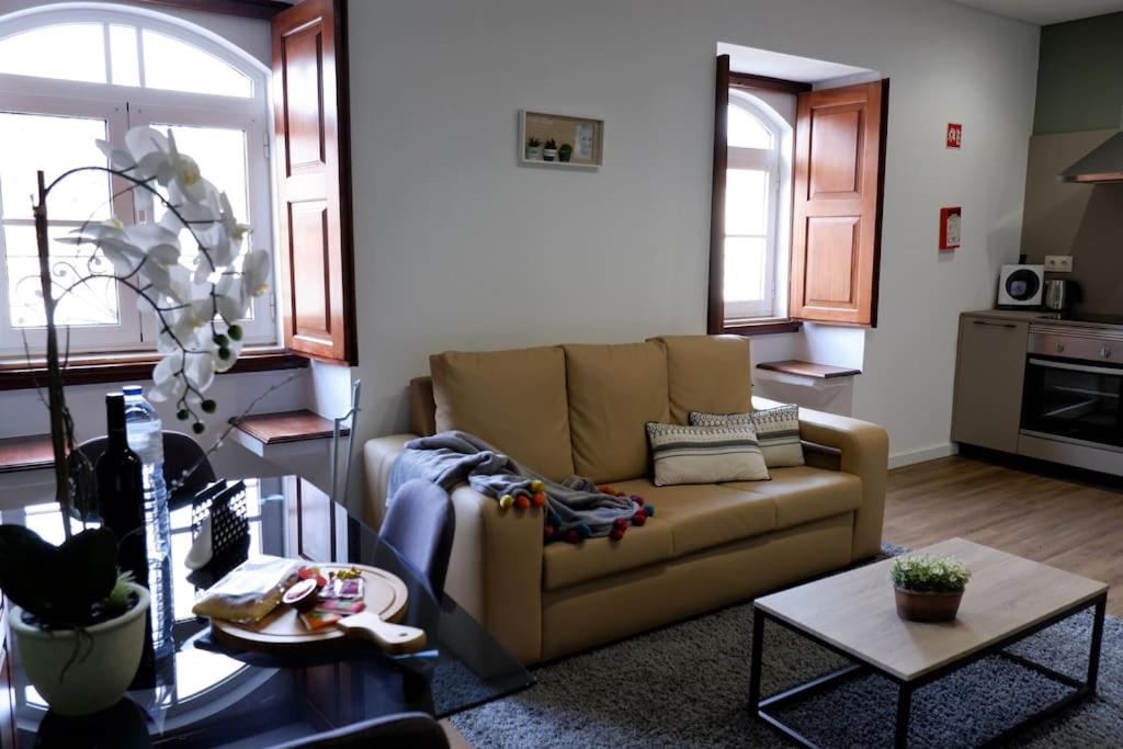 a living room with a couch and a table at O Cantinho do Colégio - Dourocollege in Lamego