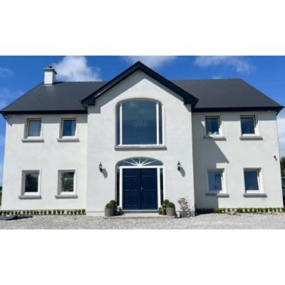 a white house with a black roof at Eastbury House P25 C3K8 in Cork