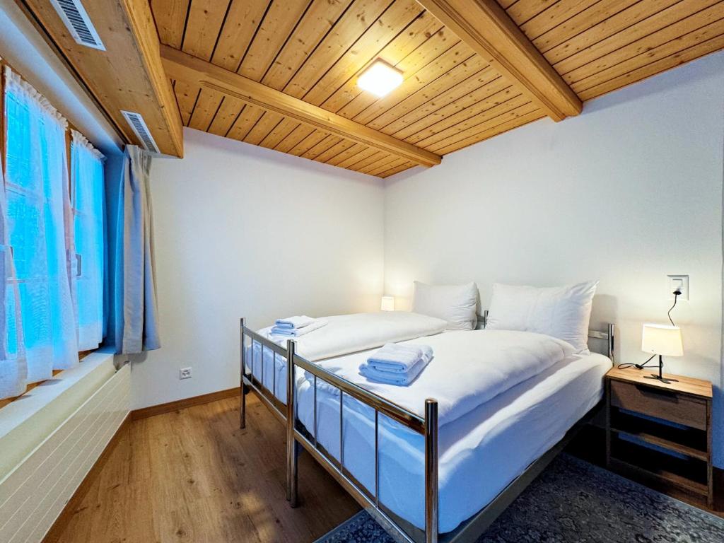 Postel nebo postele na pokoji v ubytování Veja Alvra 18 - Cadisch
