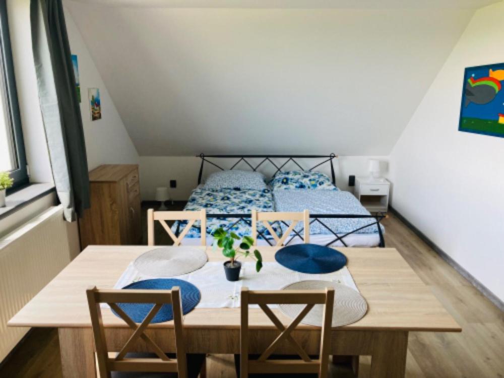 Postel nebo postele na pokoji v ubytování Apartmány Větrná 29