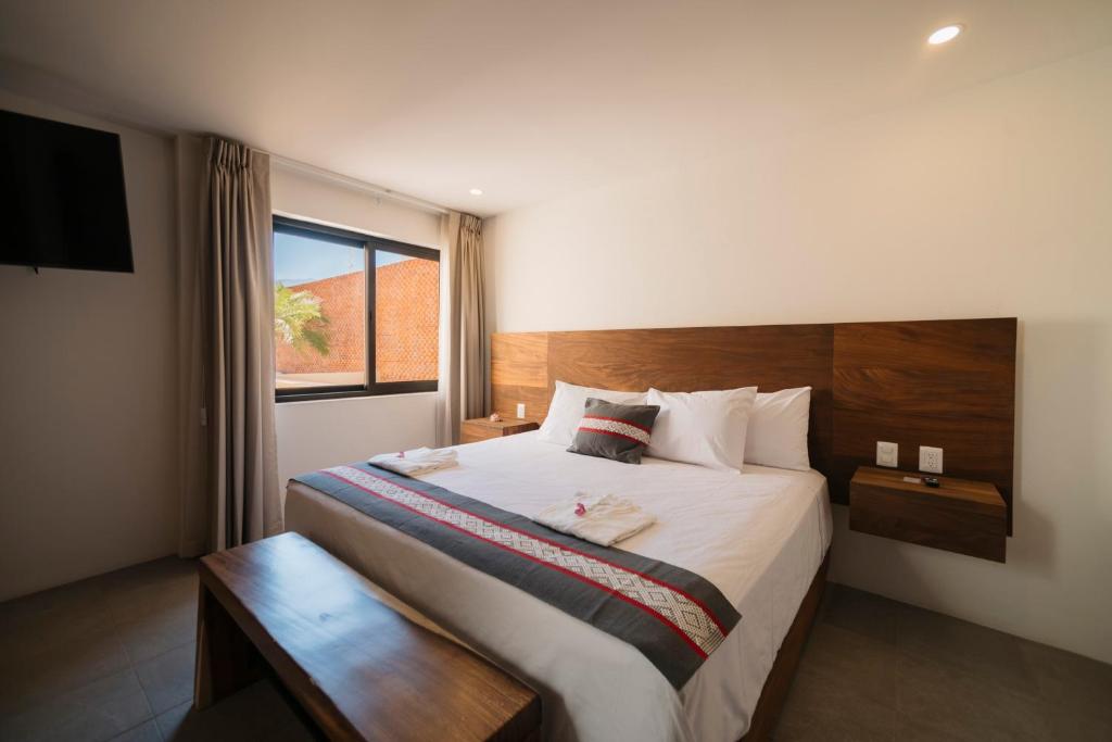Postel nebo postele na pokoji v ubytování Punta Agave Suites