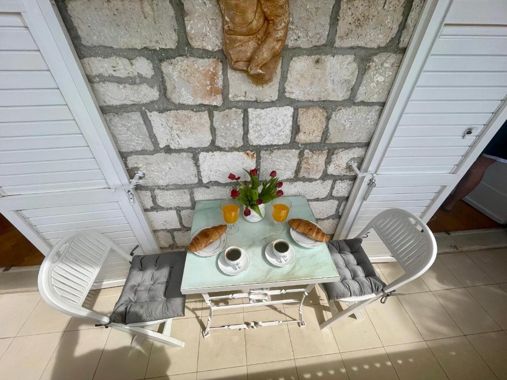 an overhead view of a table and chairs in a room at Dinka Old Town Apartment in Trogir