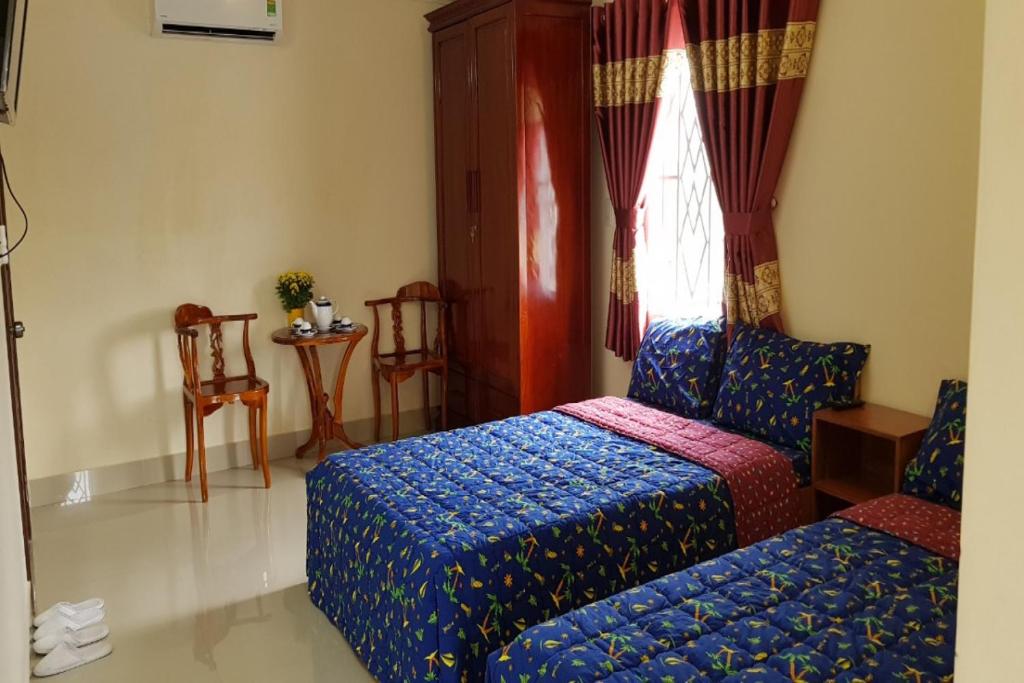 Ένα ή περισσότερα κρεβάτια σε δωμάτιο στο Mifa Homestay