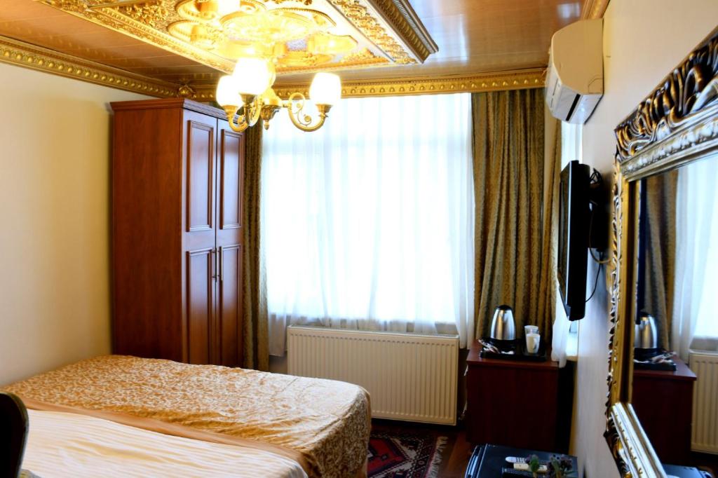 Postel nebo postele na pokoji v ubytování Californiacityhotel
