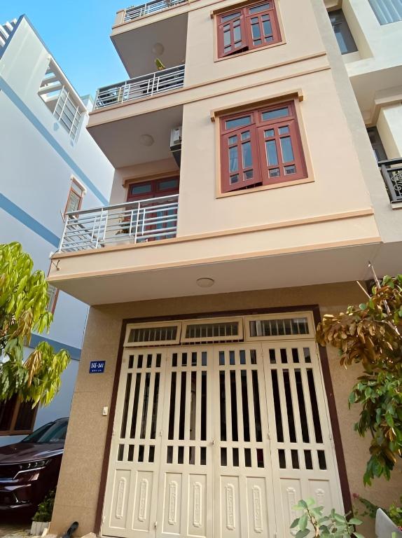 a house with a gate in front of it at Nhà Nghỉ 846-B44 in Vung Tau