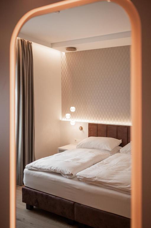 Łóżko lub łóżka w pokoju w obiekcie Hotel Europa Splendid