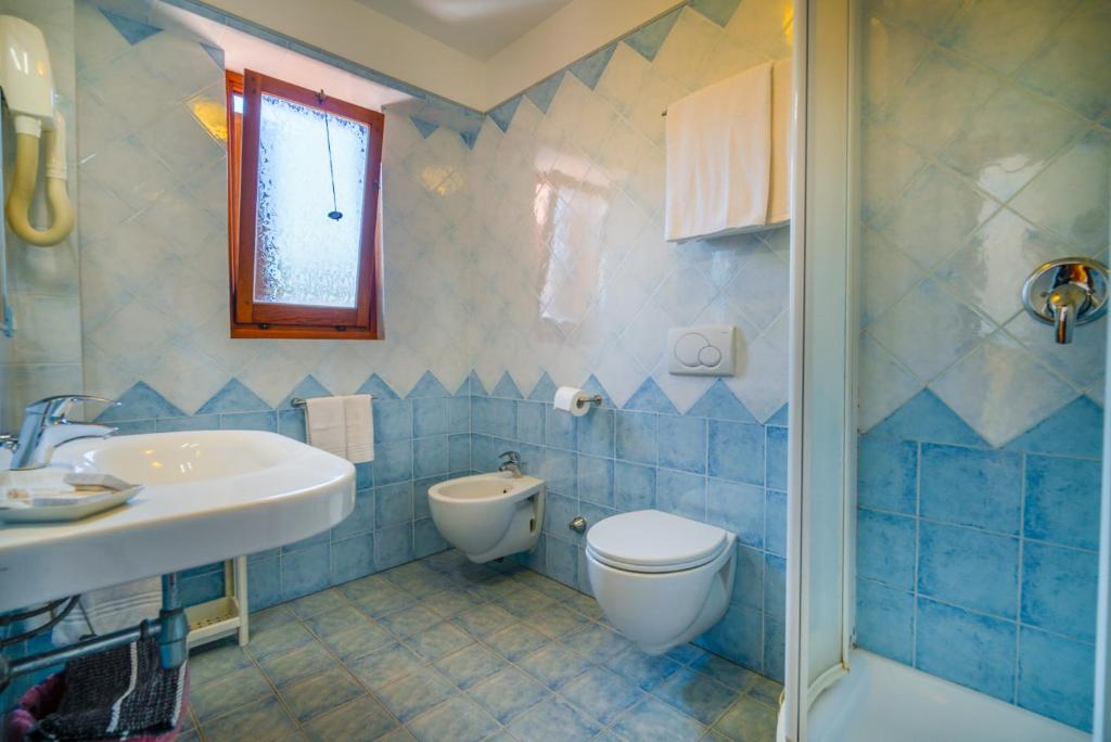 Koupelna v ubytování Hotel Da Ruggero - 100m dal Porto
