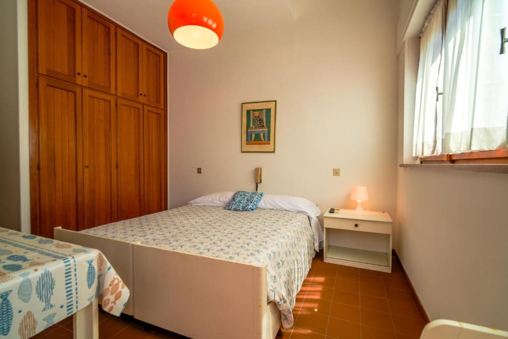 Postel nebo postele na pokoji v ubytování Hotel Da Ruggero - 100m dal Porto