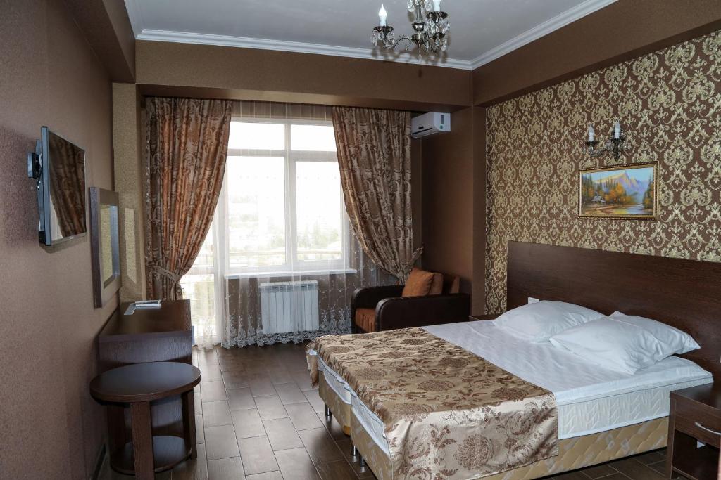 Postel nebo postele na pokoji v ubytování Antika Hotel