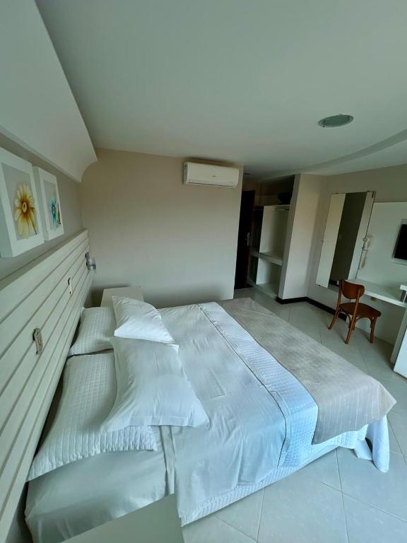 Postel nebo postele na pokoji v ubytování Violeta Meaípe Hotel