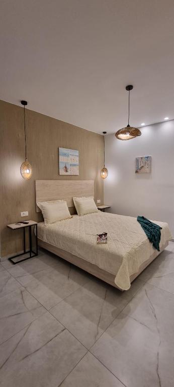 Postel nebo postele na pokoji v ubytování Bellos House