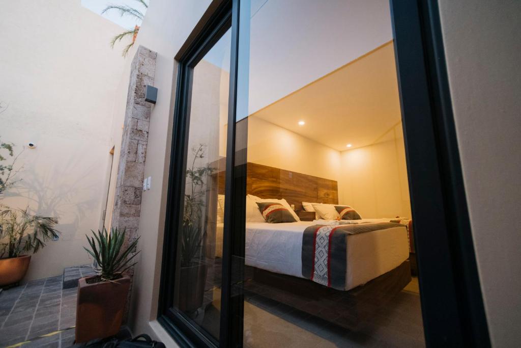 Postel nebo postele na pokoji v ubytování Punta Agave Suites