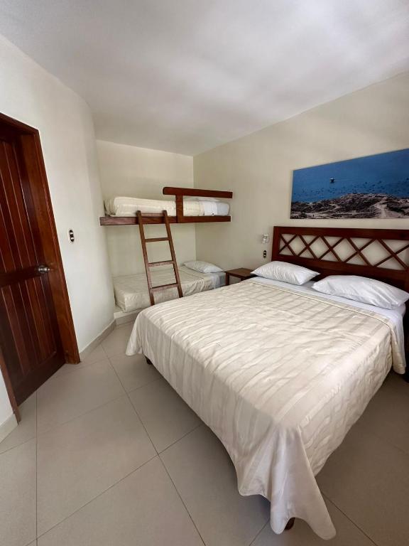 Postel nebo postele na pokoji v ubytování Bungalows Playa Bonita