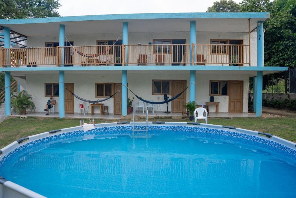 a house with a large pool in front of it at Villa Jaymar in Arboletes