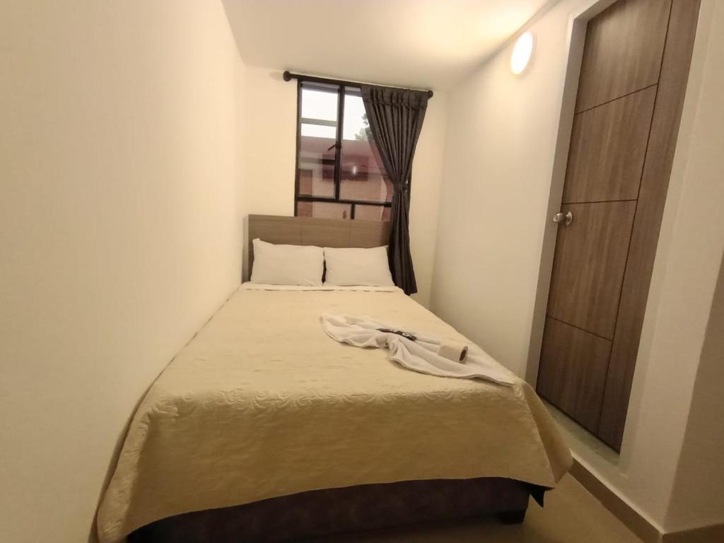 Postel nebo postele na pokoji v ubytování HOSPEDAJE SiLOM