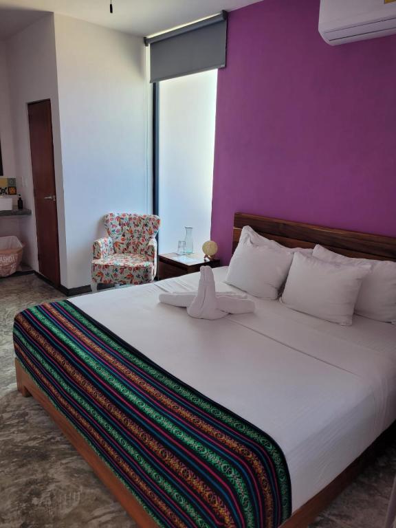 Postel nebo postele na pokoji v ubytování Itza Hotel Akumal