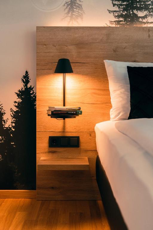 Postel nebo postele na pokoji v ubytování TARGET WORLD Hunter's Lodge