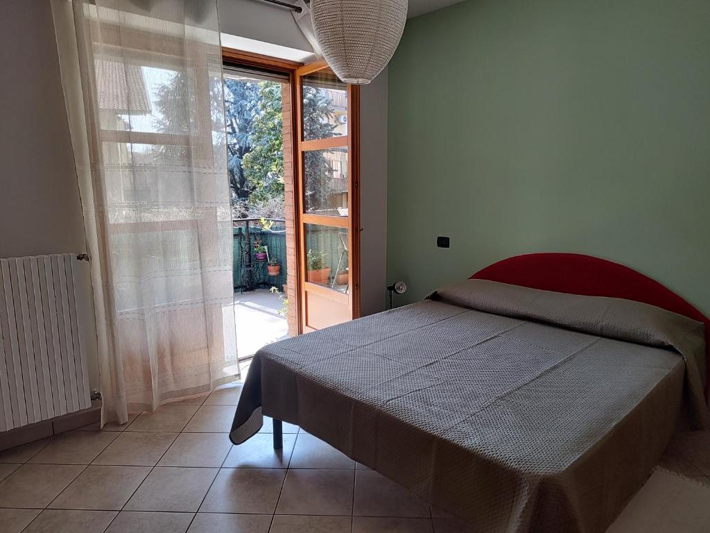 A bed or beds in a room at Bilocale con ampio terrazzo