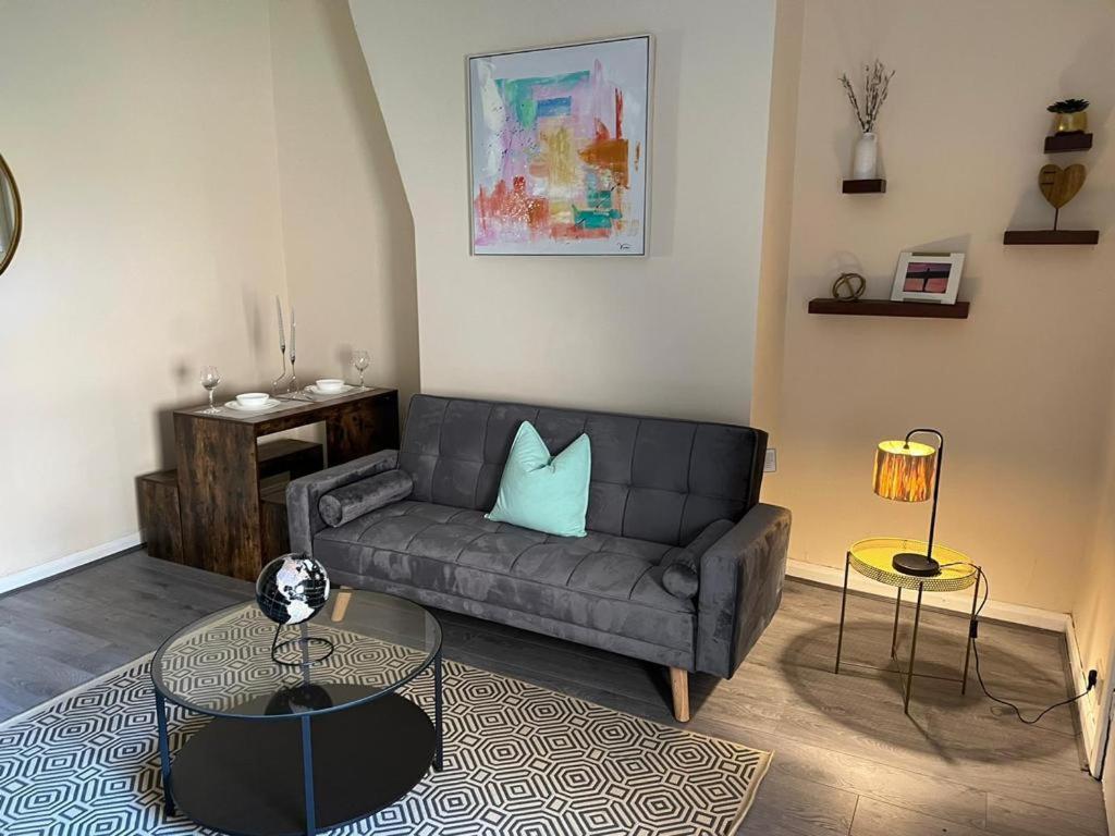 a living room with a couch and a table at AA Tyne Apartments in Gateshead