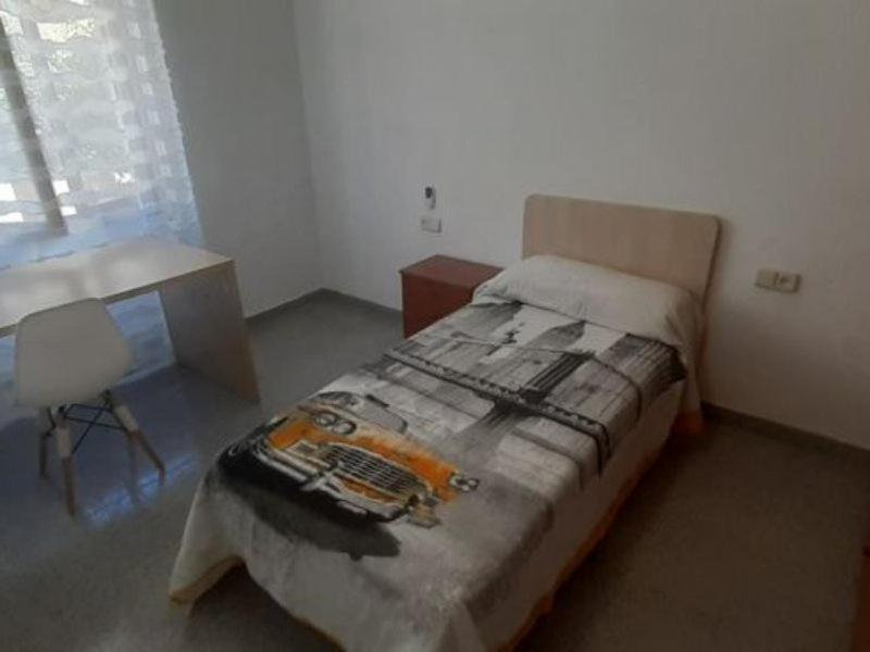Katil atau katil-katil dalam bilik di Apartamento Universidad