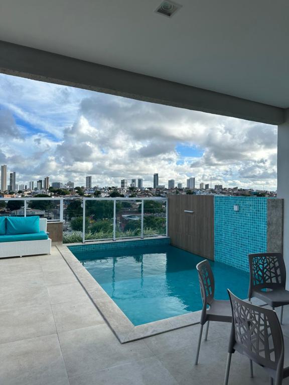 a swimming pool with a view of the city at Casa para Carnaval in Recife