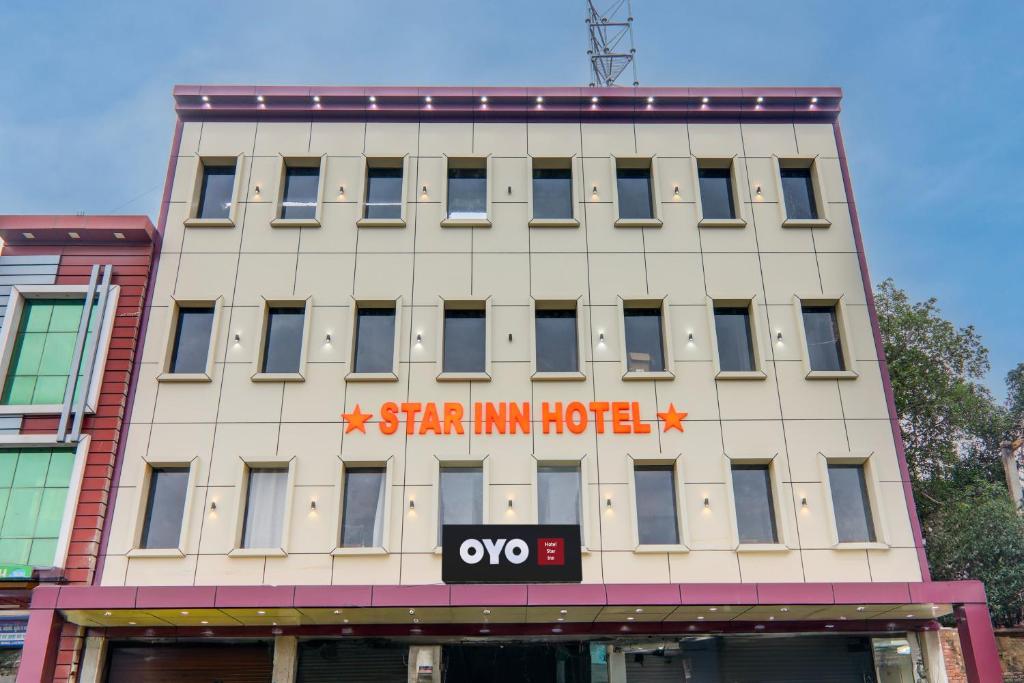 a building with a star inn hotel written on it at Collection O Star Inn Hotel in Lucknow