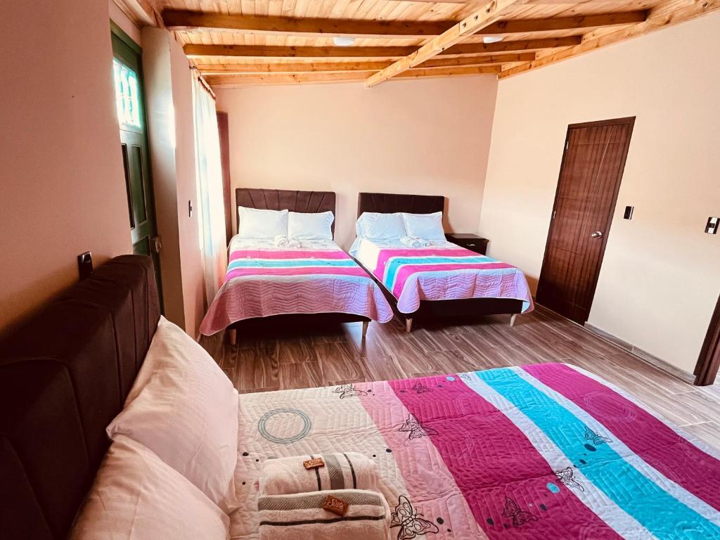 Postel nebo postele na pokoji v ubytování La Posada de Elisea - Mongui