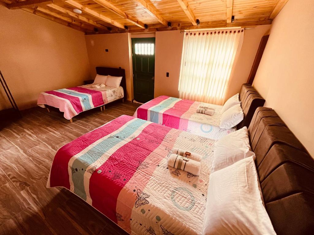 Postel nebo postele na pokoji v ubytování La Posada de Elisea - Mongui