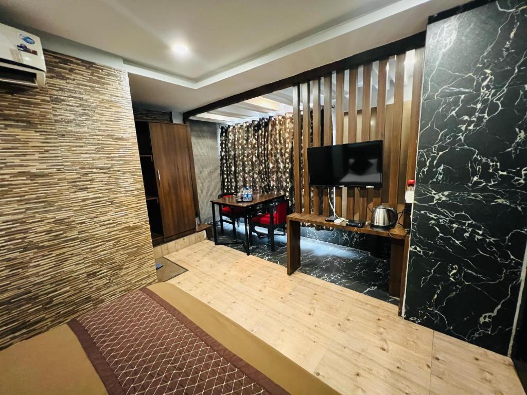 TV a/nebo společenská místnost v ubytování Hotel Sabera