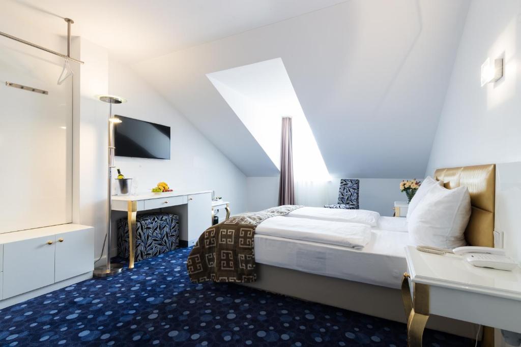 Postel nebo postele na pokoji v ubytování Hotel Bayer's
