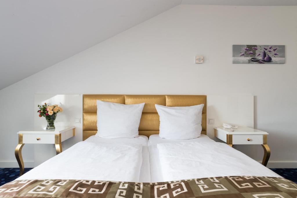 Postel nebo postele na pokoji v ubytování Hotel Bayer's