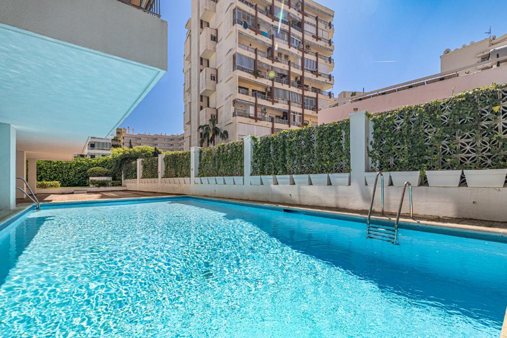 a swimming pool in the middle of a building at City Center Apartment in Marbella in Marbella