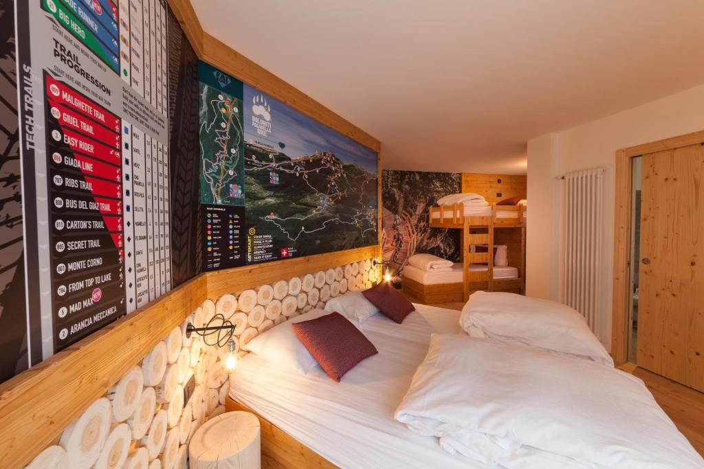 A bed or beds in a room at Rifugio La Montanara