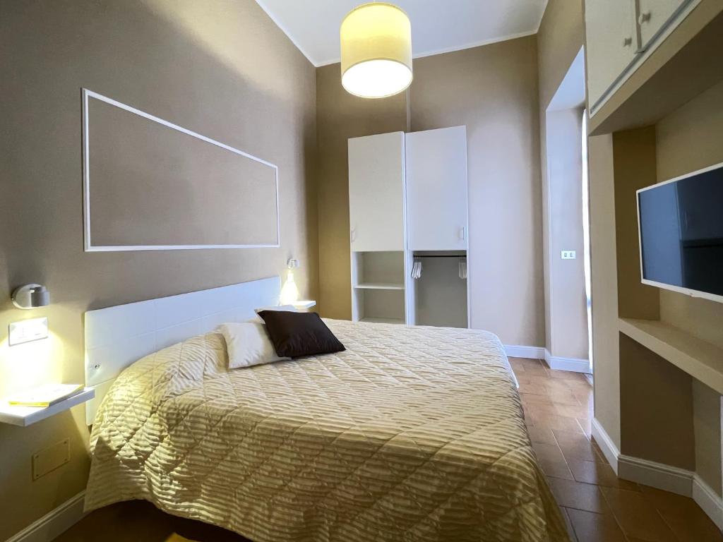 A bed or beds in a room at CASA GRAMSCI - Anzio Centro