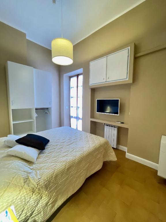 A bed or beds in a room at CASA GRAMSCI - Anzio Centro