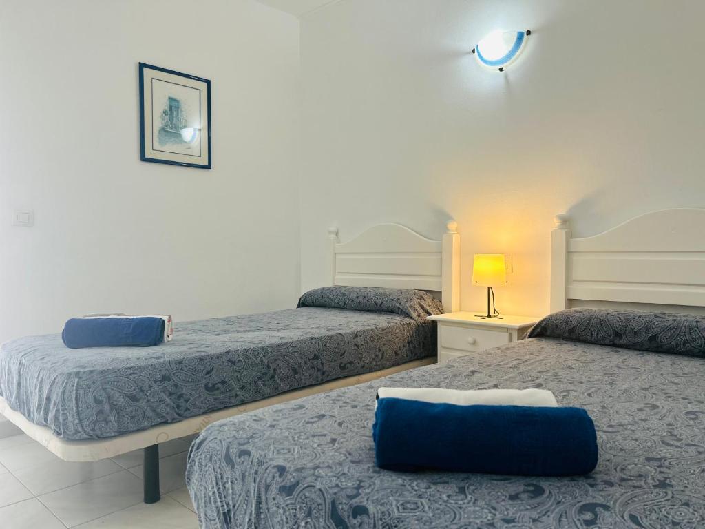 A bed or beds in a room at -MONTORIAN Apartments -LANZAROTE
