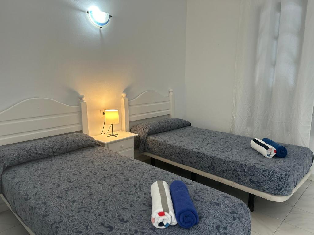 A bed or beds in a room at -MONTORIAN Apartments -LANZAROTE