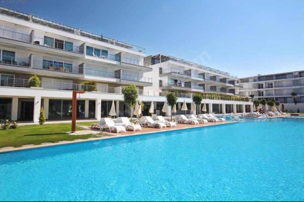 a large swimming pool in front of a building at Manavgat - Superb 2 bedroom apartment near beach and Side centre in Side
