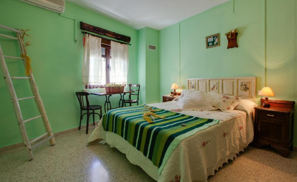 Postel nebo postele na pokoji v ubytování Casa Rural Abuela Maxi