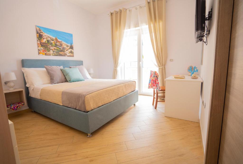 Postel nebo postele na pokoji v ubytování SYMPHONY HOUSE