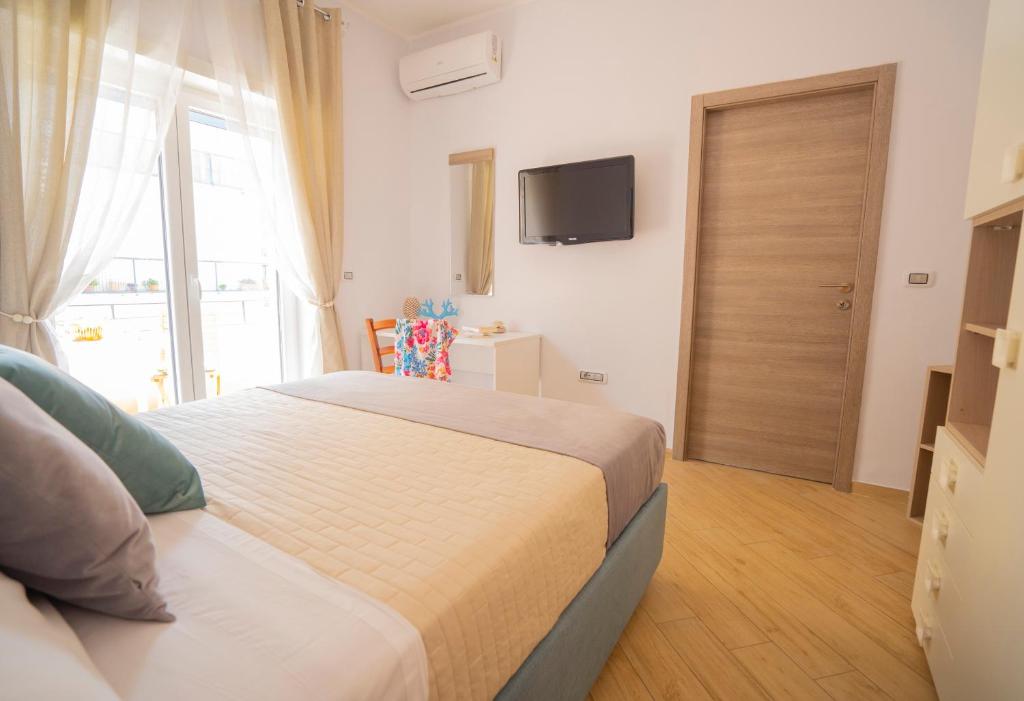 Postel nebo postele na pokoji v ubytování SYMPHONY HOUSE