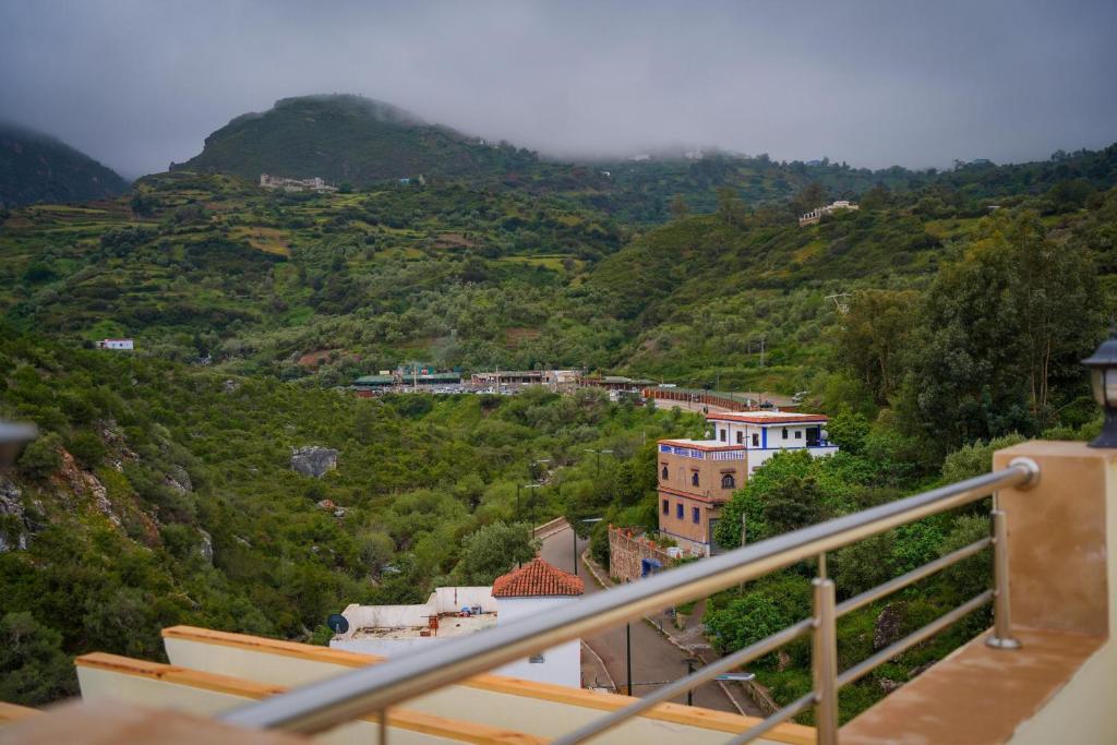 a view from a balcony of a town on a mountain at hotel el amri akchour in Akchour