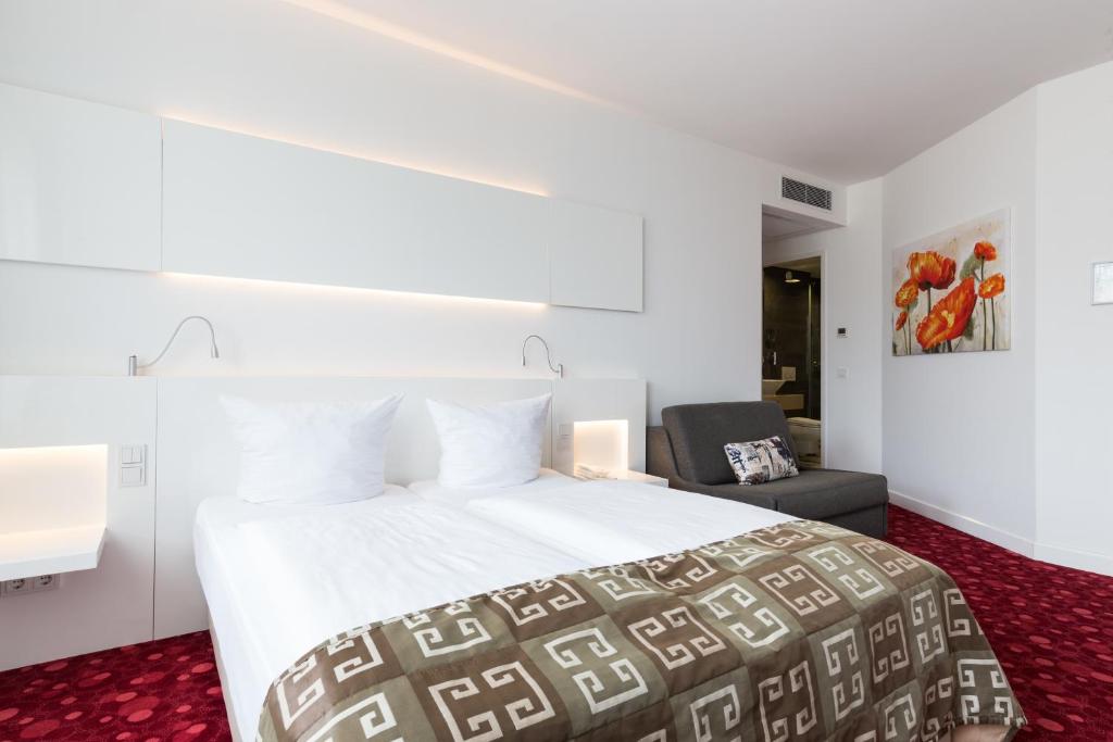 Postel nebo postele na pokoji v ubytování Hotel Bayer's
